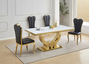 NANA PHALLE CHAIR WITH GOLD LEGS AND BLACK FAUX LEATHER SEAT.