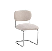ARC CHAIR WITH CHROME LEGS AND ICED BROEN FABRIC UPHOLSTERY.