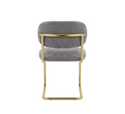 ARC CHAIR WITH GOLD LEGS AND ANTHRACITE MARBELLA FABRIC UPHOLSTERY.