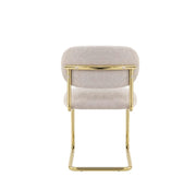 ARC CHAIR WITH GOLD LEGS AND ICED BROWN FABRIC UPHOLSTERY.