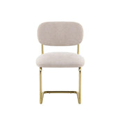 ARC CHAIR WITH GOLD LEGS AND ICED BROWN FABRIC UPHOLSTERY.
