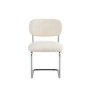 ARC CHAIR WITH SILVER LEGS AND BEIGE MARBELLA FABRIC UPHOLSTERY.