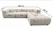 A LARGE BEIGE SECTIONAL SOFA WITH ROUNDED ARMS. MEASUREMENT 280X186CM