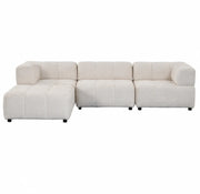 A LARGE BEIGE SECTIONAL SOFA WITH ROUNDED ARMS. MEASUREMENT 280X186CM