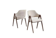 A modern armchair with a cream upholstered seat and back, dark walnut wooden frame, tapered legs, and sculptural open arms.
